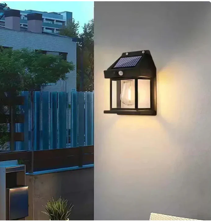 Wall-mounted solar light illuminating an exterior wall in an outdoor setting, showcasing eco-friendly design.